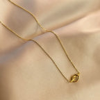 Necklace with a bow pendant for women
