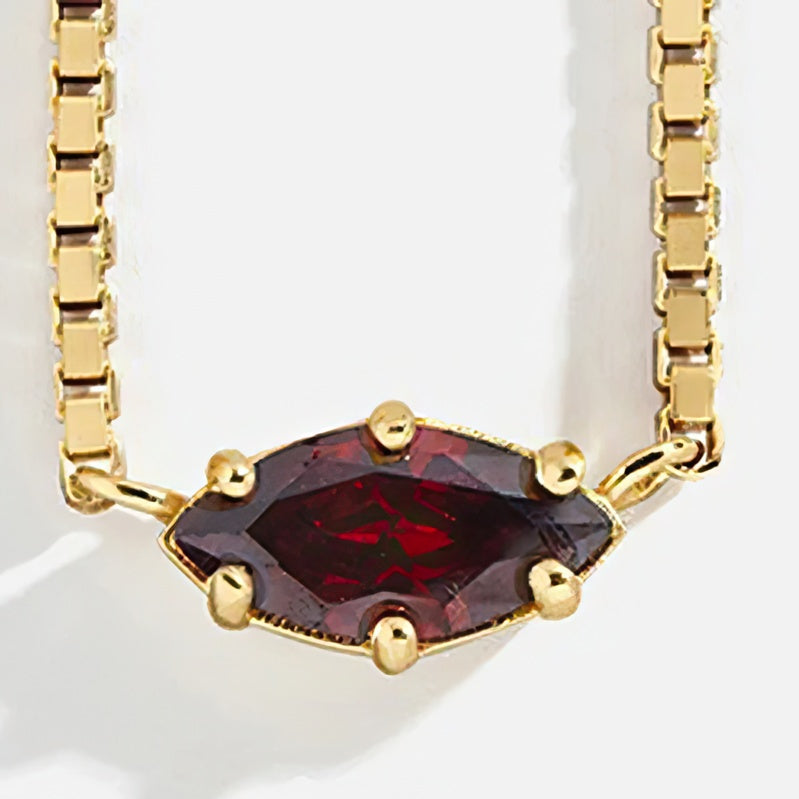 Necklace with an eye-shaped birthstone pendant