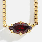 Necklace with an eye-shaped birthstone pendant