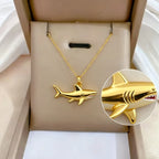 Gold shark pendant necklace