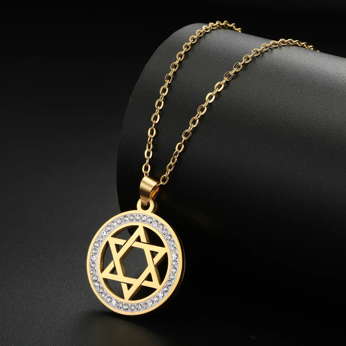 Necklace with round pendant featuring the Jewish symbol, Star of David, gold
