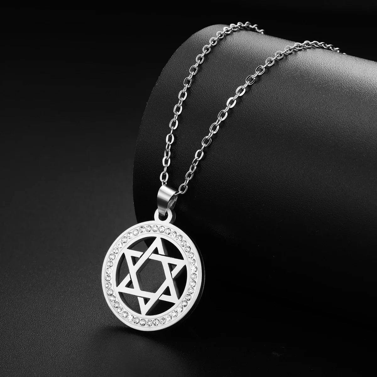 Necklace with round pendant featuring the Jewish symbol, Star of David, silver