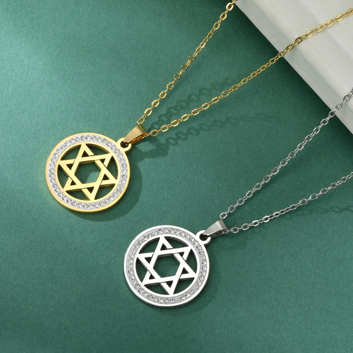 Necklace with round pendant featuring the Jewish symbol, Star of David, gold