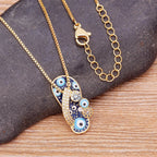 Necklace With Tongue Pendant Blue Eye And Zircon