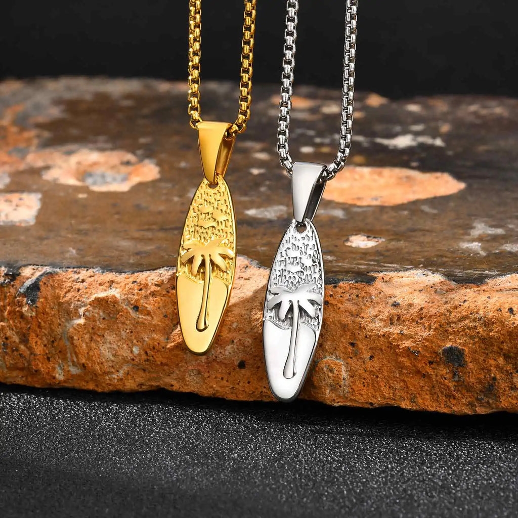 Necklace with small palm tree and sea pendant in gold