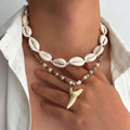 Set of 2 boho necklaces with shells and white shark tooth pendant