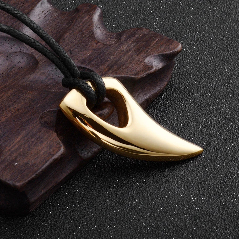 Cord necklace with gold shark tooth pendant