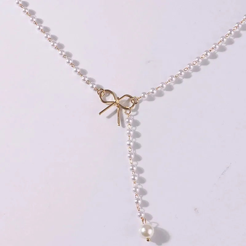 Pearl Necklace with White Bow Pendant