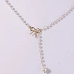Pearl Necklace with White Bow Pendant