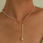 Pearl Necklace with White Bow Pendant
