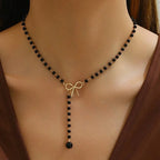 Pearl Necklace with Black Bow Pendant