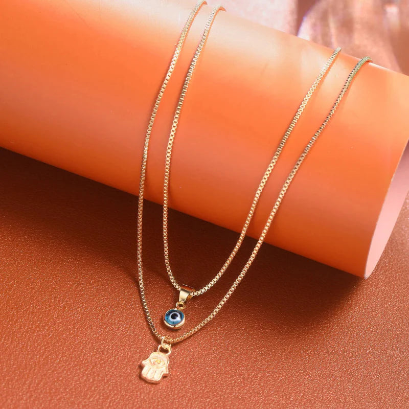 Double Necklace with Turkish Blue Eye Pendant and Gold Hand of Fatima