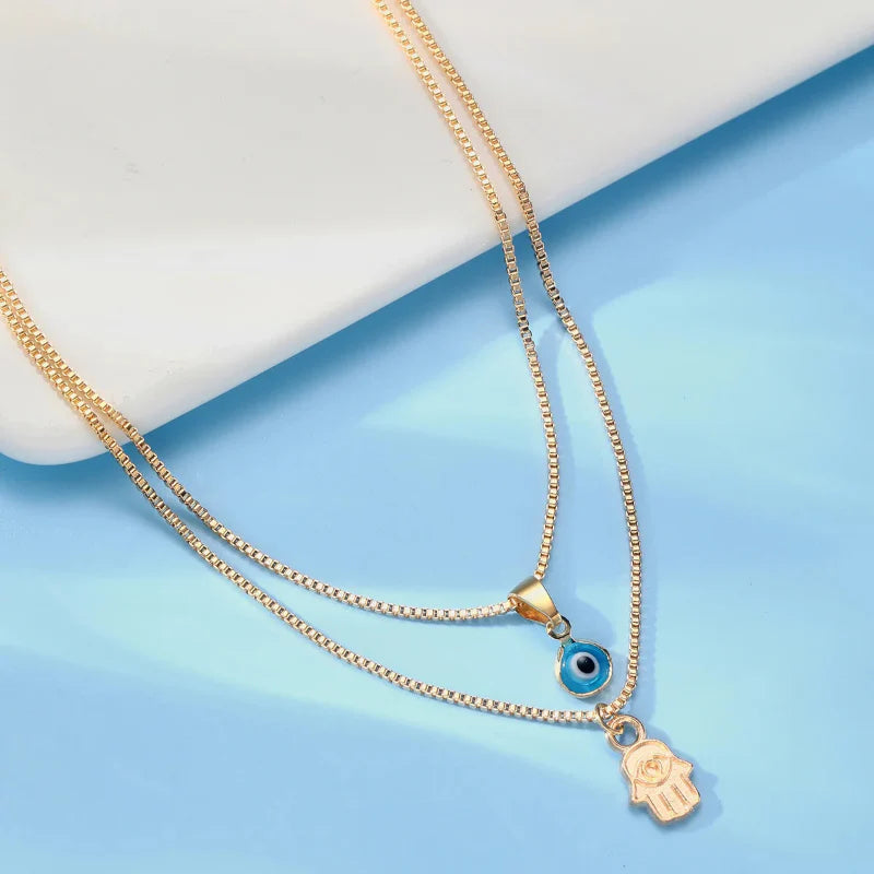 Double Necklace with Turkish Blue Eye Pendant and Gold Hand of Fatima