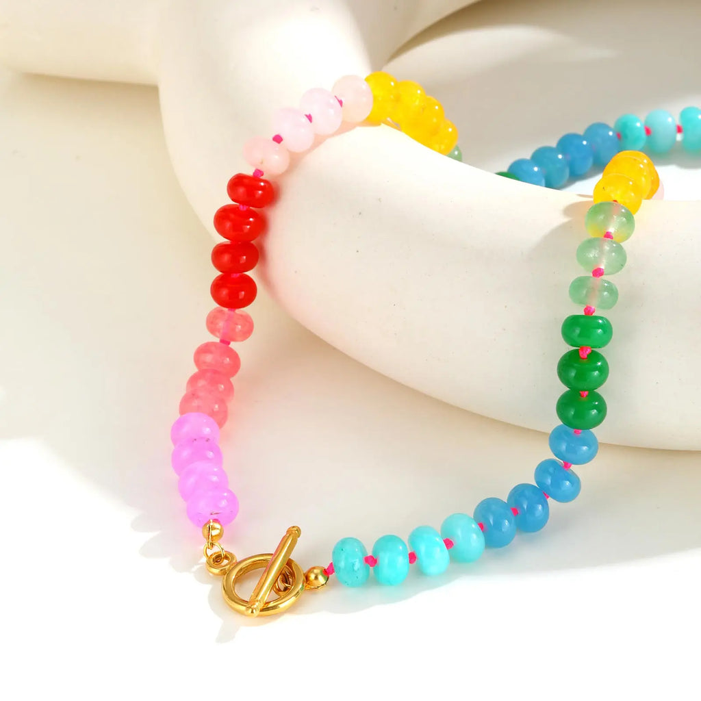 Necklace with rainbow pendant and beads