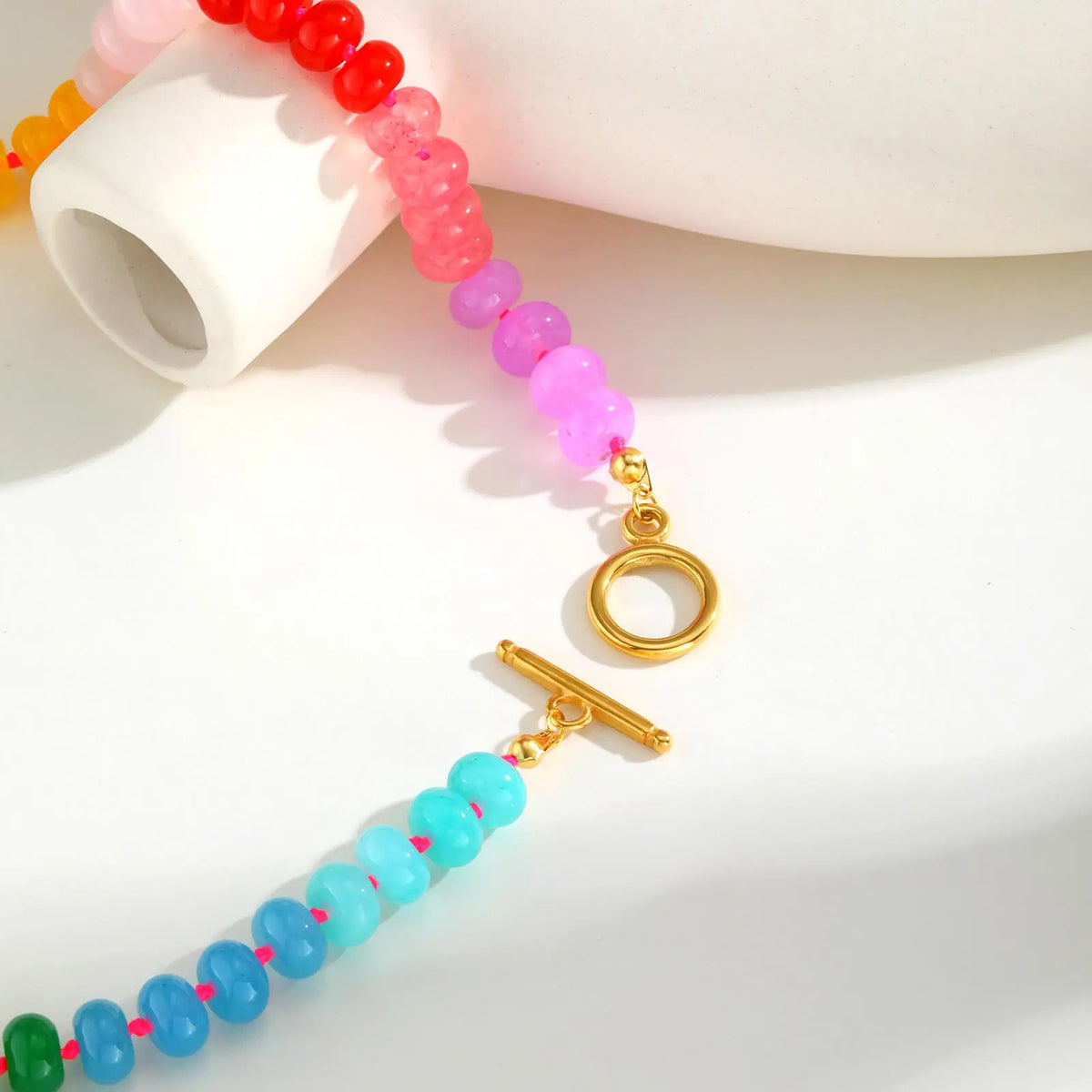 Necklace with rainbow pendant and beads