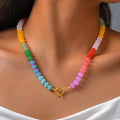 Necklace with rainbow pendant and beads