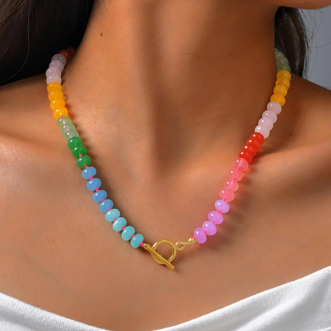 Necklace with rainbow pendant and beads