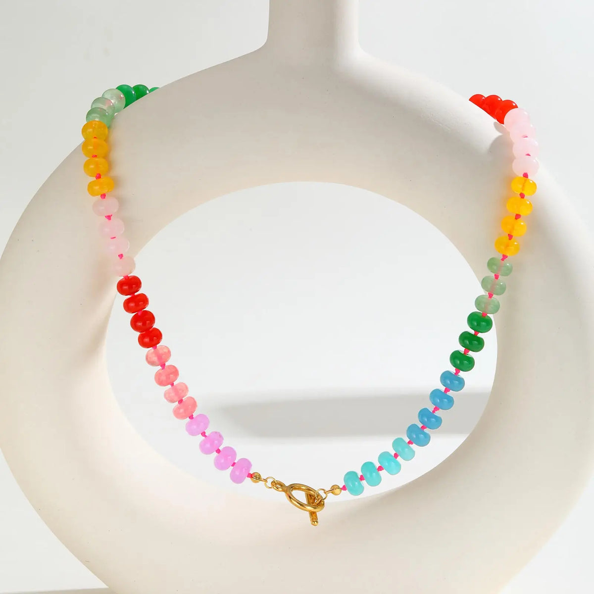 Necklace with rainbow pendant and beads