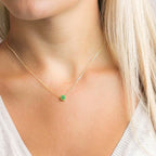 Necklace and pendant with small round birthstone May