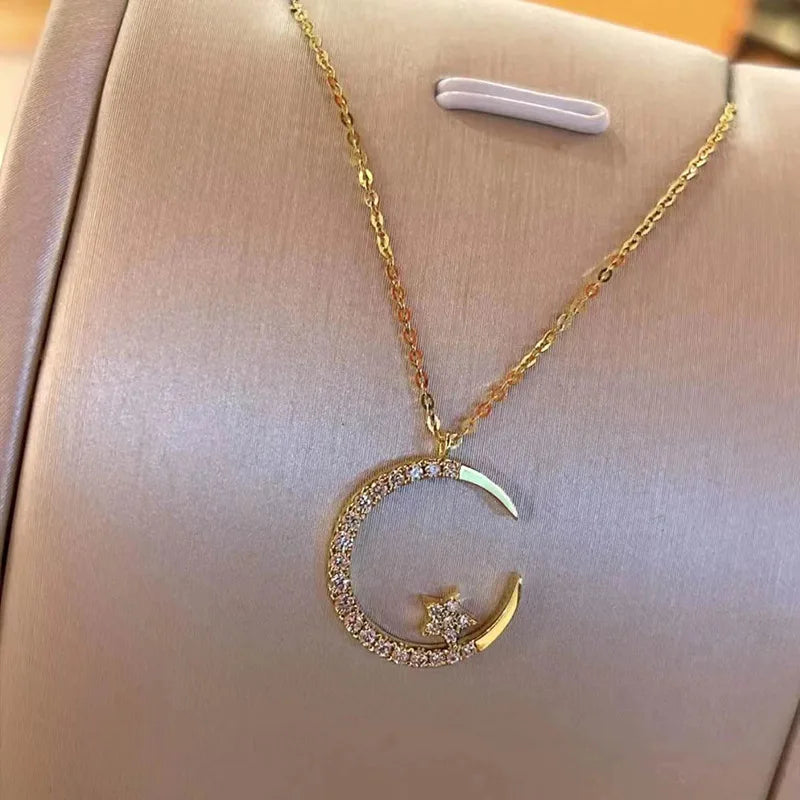 Shiny necklace with star and moon pendant