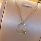 Shiny necklace with star and moon pendant