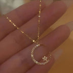 Shiny necklace with star and moon pendant