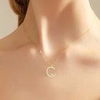 Shiny necklace with star and moon pendant
