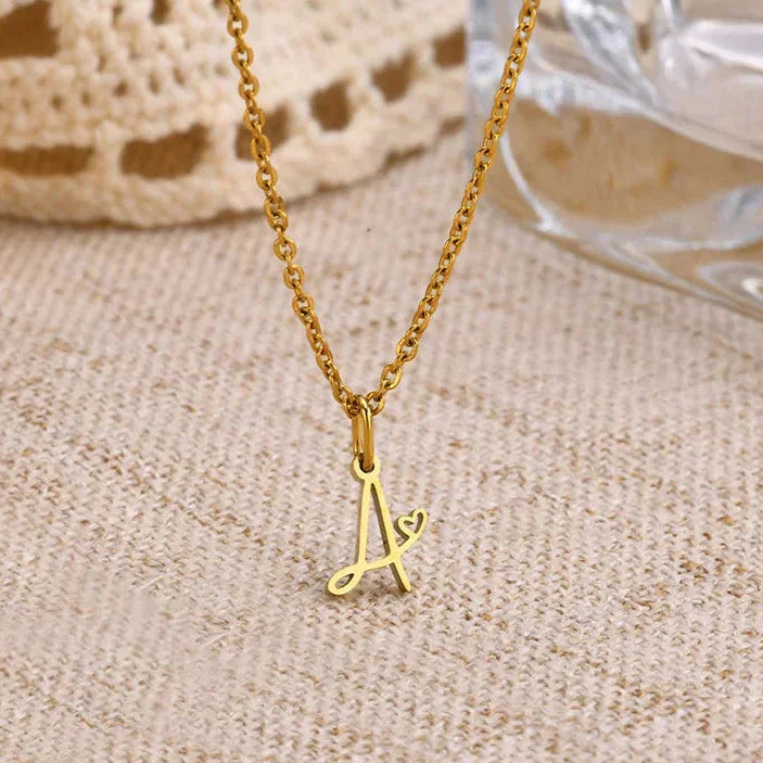 Women's necklace with initial letter and heart pendant