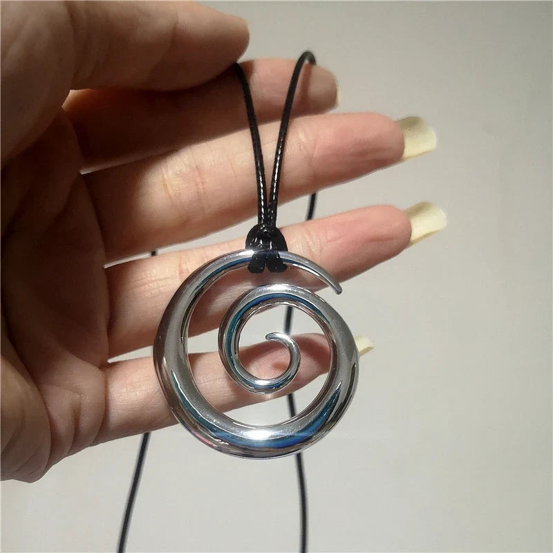Long necklace with silver-toned spiral pendant