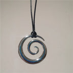 Long necklace with silver-toned spiral pendant