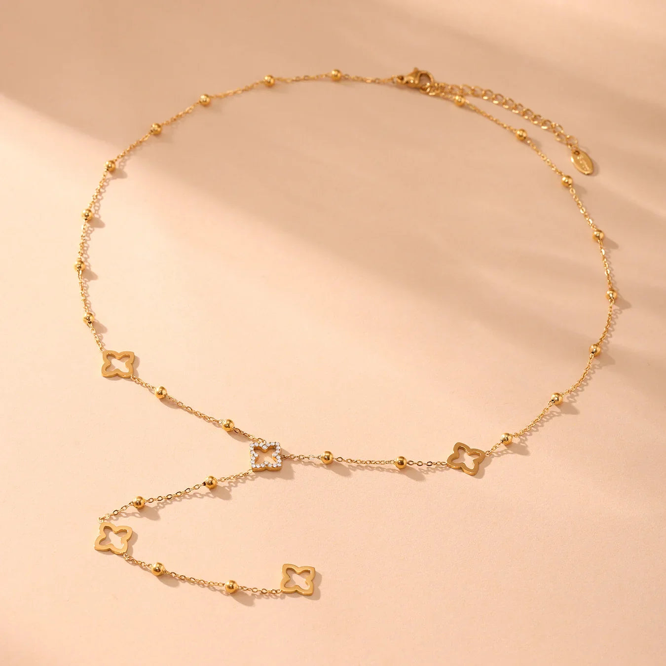 Long Necklace with Four-Leaf Clover and Gold Zircon Pendants
