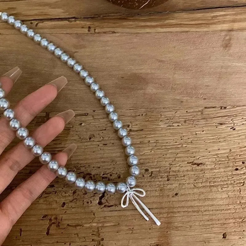 Pendant Necklace with Grey Beads and Bow Knot