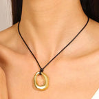 Hollow Water Drop Pendant Necklace black and gold cord