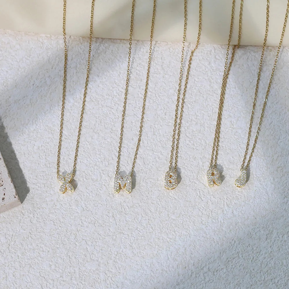 Women's choker necklace with minimalist initial pendant