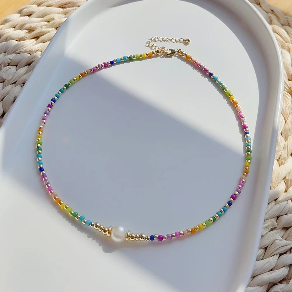 Choker necklace with rainbow pendant and beads