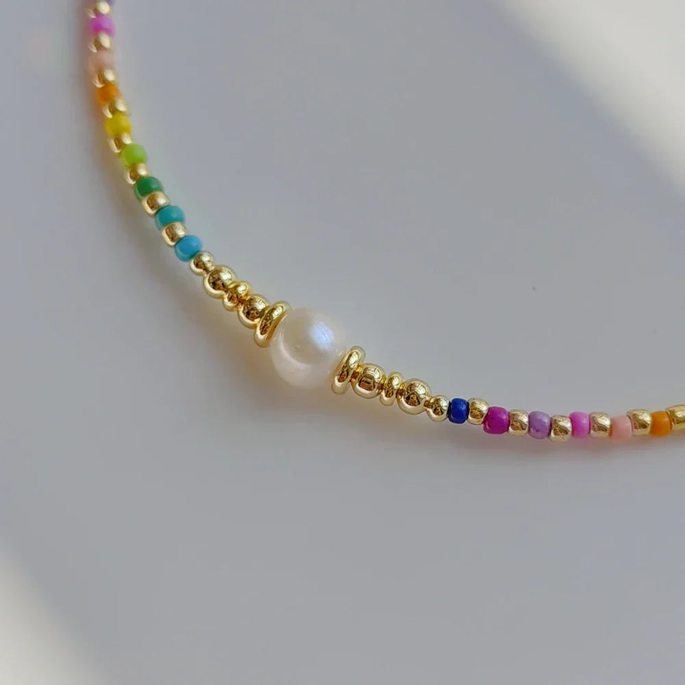 Choker necklace with rainbow pendant and beads