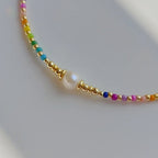 Choker necklace with rainbow pendant and beads