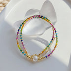 Choker necklace with rainbow pendant and beads