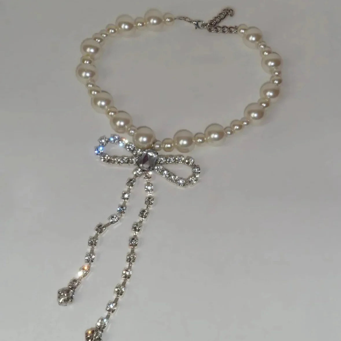 Choker necklace with a rhinestone bow tie pendant