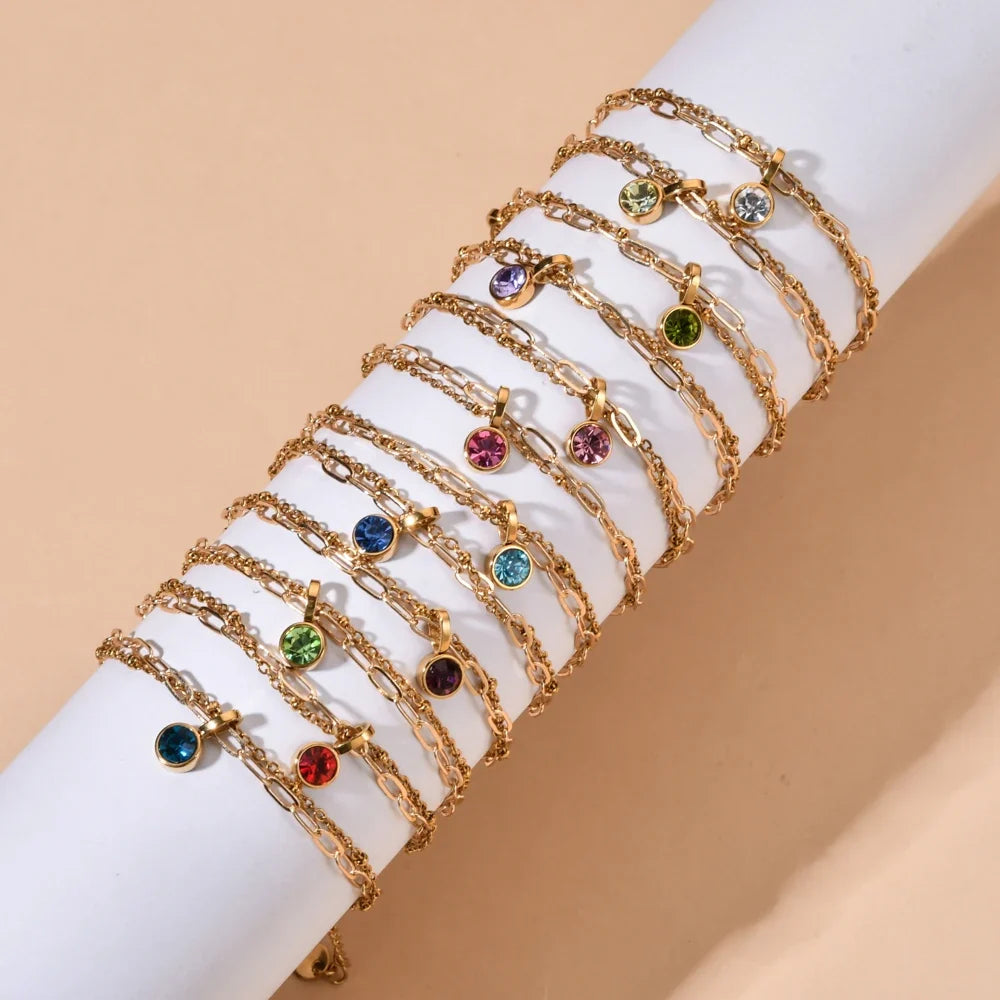 Double gold-tone bracelet with January birthstone