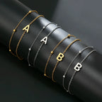 Double initial bracelet in gold and silver