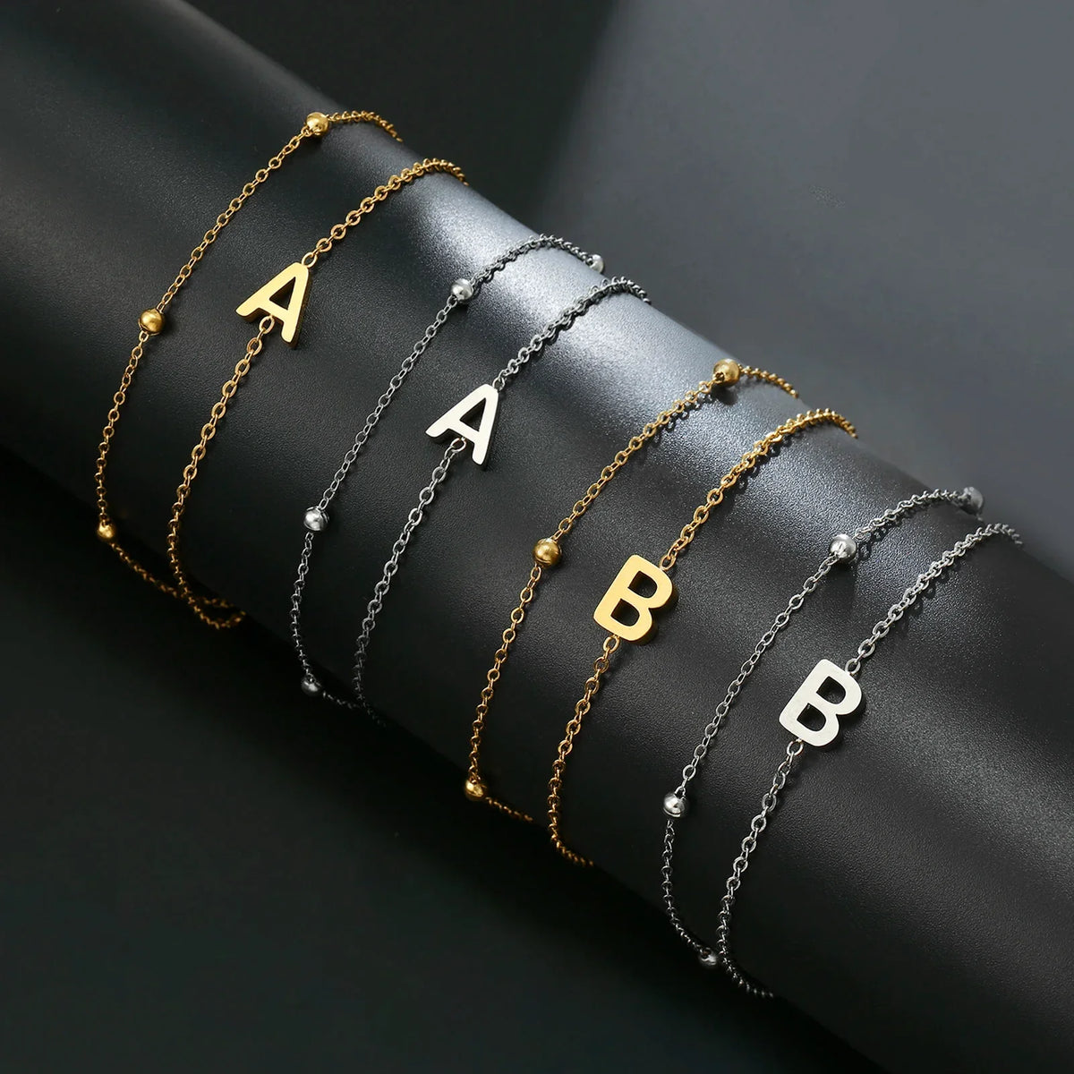 Double initial bracelet in gold and silver