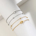 Double initial bracelet in gold and silver  s