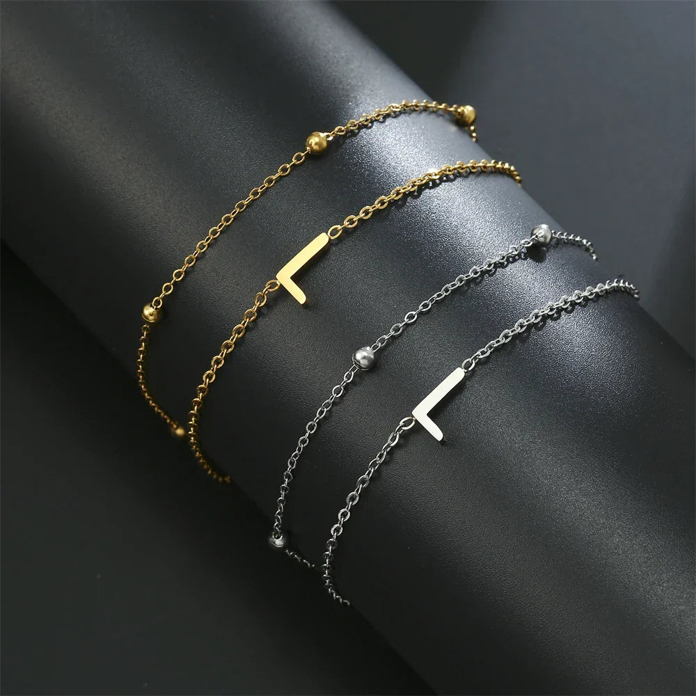 Double initial bracelet in gold and silver l