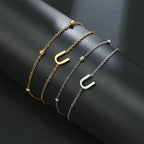 Double initial bracelet in gold and silver  u