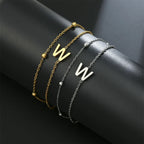 Double initial bracelet in gold and silver  w