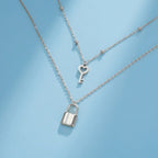 Double necklace with key and lock pendant in silver
