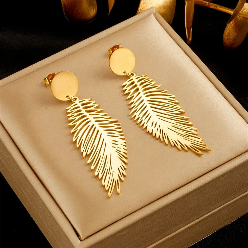 Large stylized feather earrings