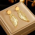 Large stylized feather earrings