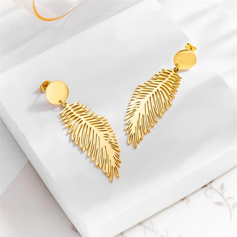 Large stylized feather earrings